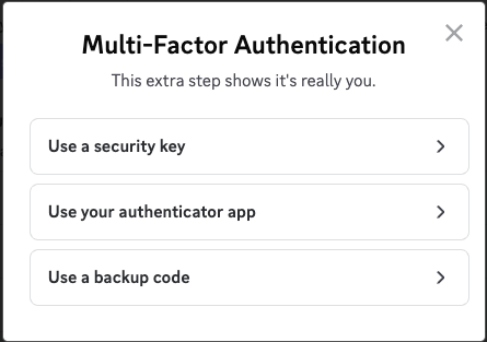 Discord promoting to the user to choose between three MFA options: Use a security key, use your authenticator app, or use a backup code.‍